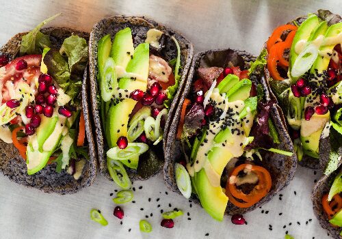 Black tortilla tacos with avocado and pomegranate Black tortilla tacos with avocado and pomegranate
