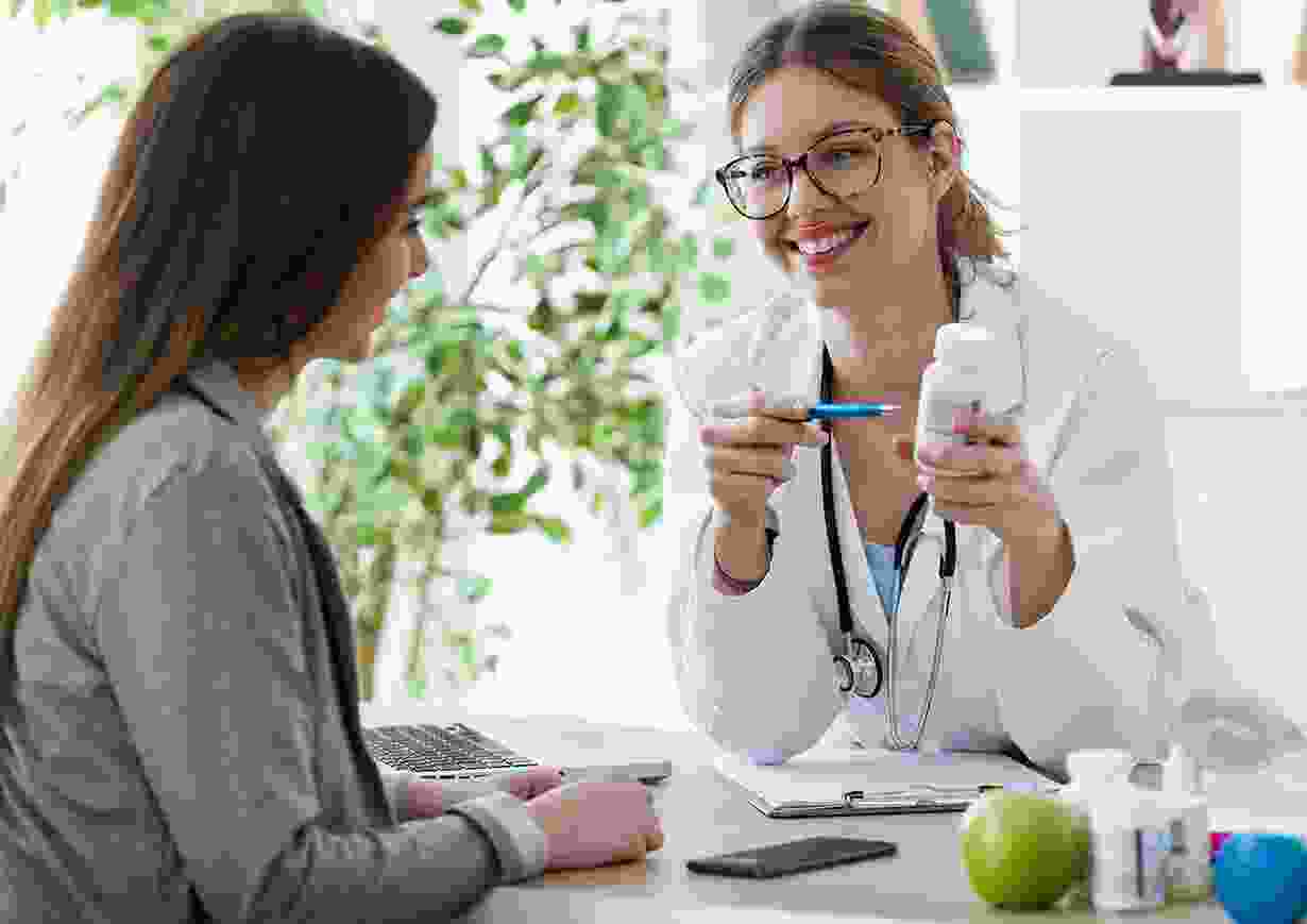 Doctor explaining medication to patient